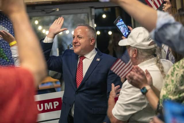 South Carolina Rep. Russell Fry celebrates his win over U.S. Rep. Tom Rice for his congressional seat in the Republican primary, at the 8th Avenue Tiki Bar in Myrtle Beach, S.C., Tuesday, June 14, 2022.(Jason Lee/The Sun News via AP)