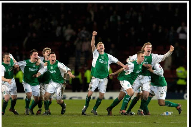 Hibs players -including Stephen Dobbie, second from left - celebrate their penalty shoot-out victory over Rangers in the 2004 League Cup semi-final ... Pic Donald MacLeod 05.02.04