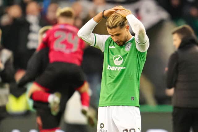 Hibs' Emiliano Marcondes looks dejected as St Mirren celebrate. (Photo by Simon Wootton / SNS Group)