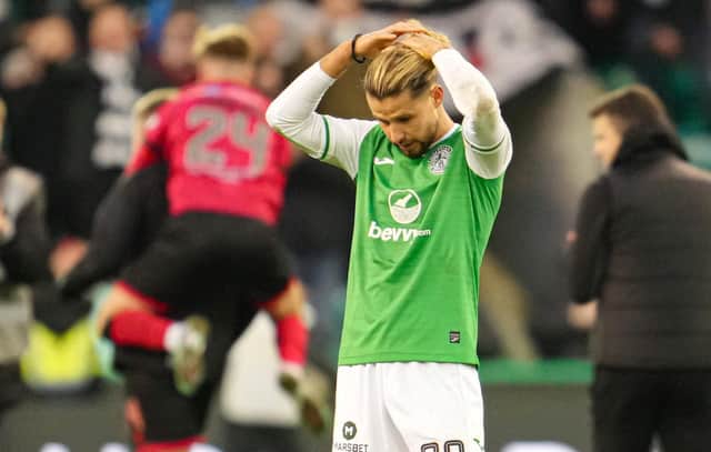 Hibs' Emiliano Marcondes looks dejected as St Mirren celebrate. (Photo by Simon Wootton / SNS Group)