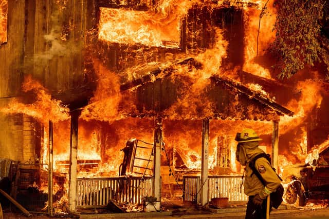 Fire consumes a home as the Sugar Fire, part of the Beckwourth Complex Fire, tears through Doyle, in the US state of California last week Pushed by heavy winds, the fire came out of the hills and destroyed multiple residences in central Doyle