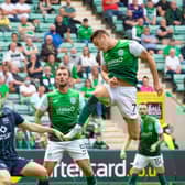 Kyle Magennis heads Hibs into a 2-0 lead against Ross County.