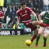 Scott McKenna fouls Hibs' John McGinn in a Scottish Cup game in 2017, reducing visitors Ayr United to ten men. Picture: SNS