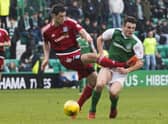 Scott McKenna fouls Hibs' John McGinn in a Scottish Cup game in 2017, reducing visitors Ayr United to ten men. Picture: SNS