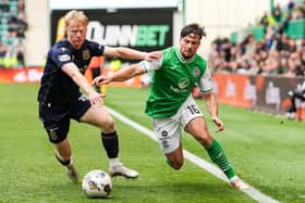 Hibs' Lewis Stevenson tries to get past Dundee's Lyall Cameron during the 0-0 draw at Easter Road.