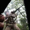 A Ukrainian soldier fires towards Russian positions at the frontline near the town of Bakhmut, Donetsk region (Picture: Anatolii Stephanov/AFP via Getty Images)