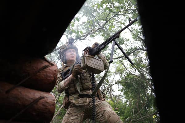 A Ukrainian soldier fires towards Russian positions at the frontline near the town of Bakhmut, Donetsk region (Picture: Anatolii Stephanov/AFP via Getty Images)