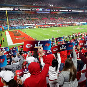 Fans hold up signs in the stands during Super Bowl LV between the Tampa Bay Buccaneers and the Kansas City Chiefs at Raymond James Stadium on 7 February 2021. (Pic: Getty Images)