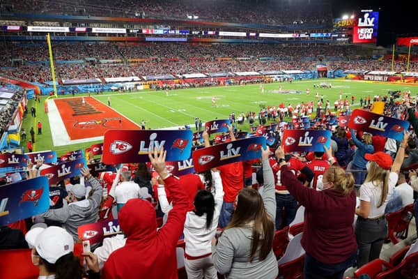 Fans hold up signs in the stands during Super Bowl LV between the Tampa Bay Buccaneers and the Kansas City Chiefs at Raymond James Stadium on 7 February 2021. (Pic: Getty Images)