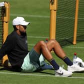 Nick Kyrgios takes a break during practice to contemplate the Slam showpiece he thought was beyond him.