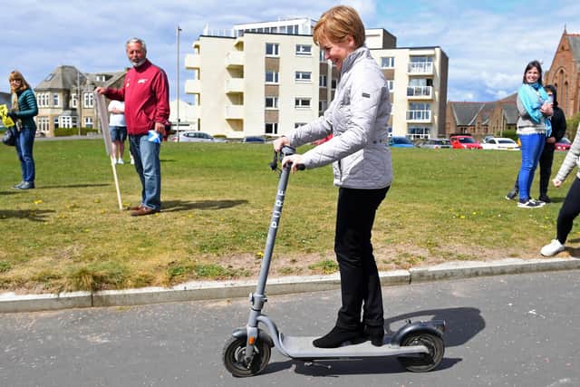 First Minister Nicola Sturgeon tries out a scooter in Troon during campaigning for the Scottish Parliamentary election. Picture: Andy Buchanan/PA Wire