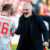 Aberdeen manager Jim Goodwin celebrates with Ylber Ramadani at full-time following the 2-1 win over Motherwell at Fir Park. (Photo by Craig Foy / SNS Group)