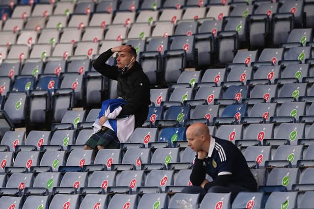 Scotland supporters react to the 3-1 defeat to Croatia at Hampden that ended their Euro 2020 hopes (Photo by STU FORSTER/POOL/AFP via Getty Images)