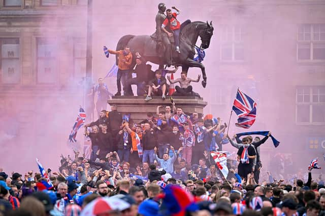 The Rangers title celebrations quickly turned ugly with police officers injured as they struggled to control the mayhem (Picture: Jeff J Mitchell/Getty Images)