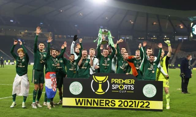 Celtic’s David Turnbull  lifts the Premier Sports Cup Trophy as Celtic celebrate. (Photo by Alan Harvey / SNS Group)