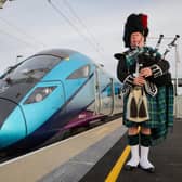 Sandy Mutch, the Border Piper, welcomes in the 6.16am TransPennine Express service to Reston Station, the first passenger service to stop in the village for more than 50 years. (Picture: Jason Lock)