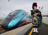 Sandy Mutch, the Border Piper, welcomes in the 6.16am TransPennine Express service to Reston Station, the first passenger service to stop in the village for more than 50 years. (Picture: Jason Lock)