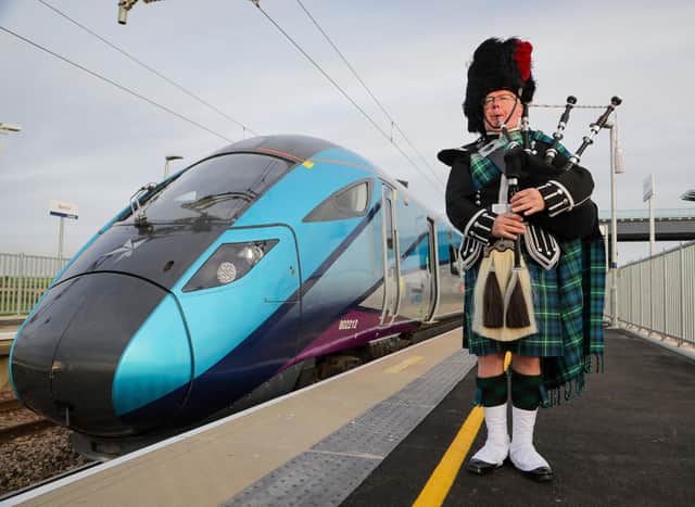 Sandy Mutch, the Border Piper, welcomes in the 6.16am TransPennine Express service to Reston Station, the first passenger service to stop in the village for more than 50 years. (Picture: Jason Lock)