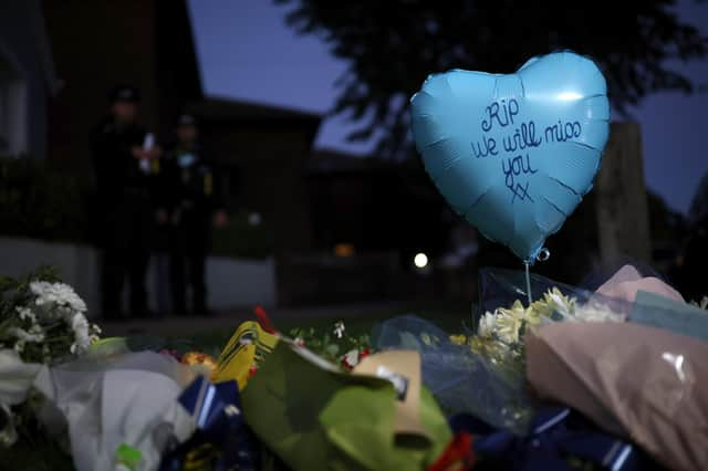 Flowers left at the scene following the stabbing of Sir David Amess