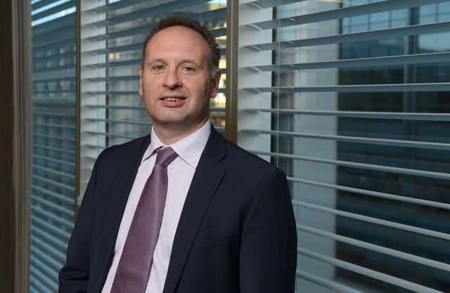 Brown says his previous roles include everything from teller and tea boy to supporting corporate deals. Picture: Neil Hanna.