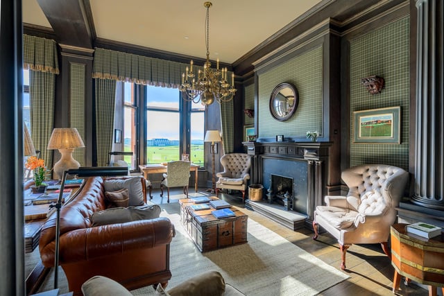 Interior The apartment’s open-plan living and kitchen space has a south-facing window, and features a fireplace with an Adam-style mantel. The Kohler kitchen boasts a breakfast bar and Belfast sink, while the principal bedroom suite couples a jacuzzi bath with a dressing area.