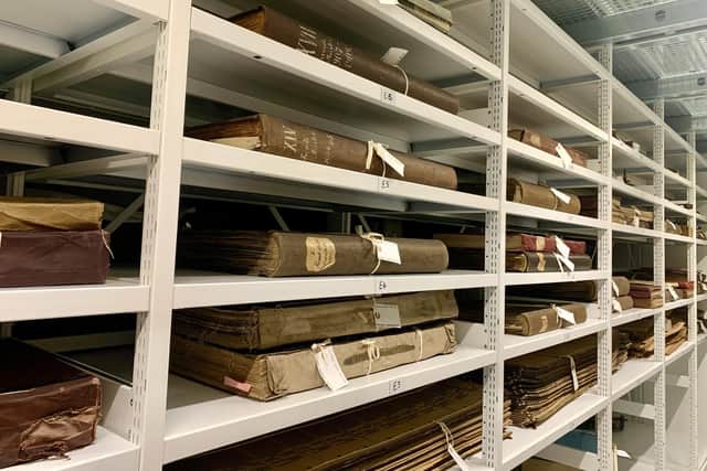 Sample books from Dunfermline's linen and lace manufacturers can be found on the shelves of the former Amazon factory in Glenrothes. PIC: OnFife.