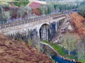 An 80ft-long section of the bridge parapet collapsed on Friday. Picture: Network Rail