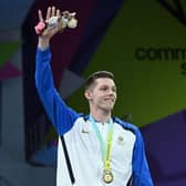 Scotland's Duncan Scott struck gold in the men's 200m freestyle swimming event on day two of the Commonwealth Games in Birmingham.