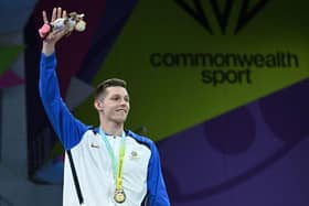 Scotland's Duncan Scott struck gold in the men's 200m freestyle swimming event on day two of the Commonwealth Games in Birmingham.