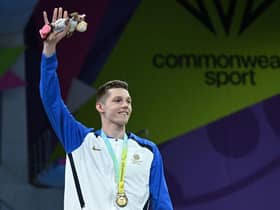 Scotland's Duncan Scott struck gold in the men's 200m freestyle swimming event on day two of the Commonwealth Games in Birmingham.