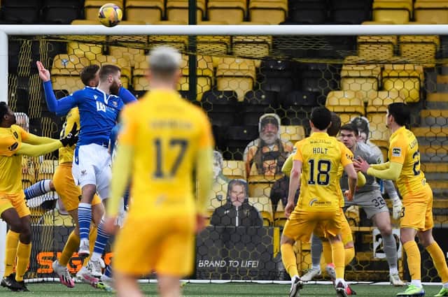 St Johnstone's Shaun Rooney rises highest to head his side into a 2-0 lead against Livingston  (Photo by Sammy Turner / SNS Group)