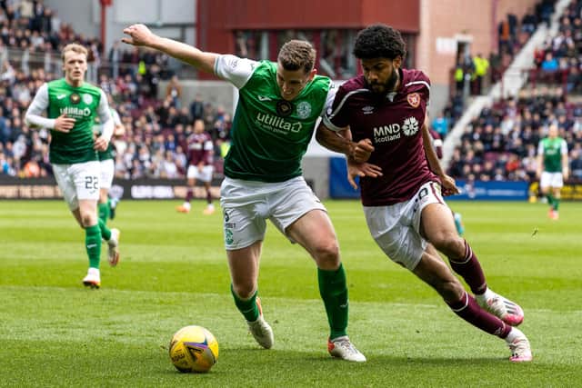 Paul Hanlon and Ellis Simms in action during the last Hearts v Hibs derby.