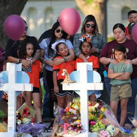 UVALDE, TEXAS - MAY 26: People visit memorials for victims of Tuesday's mass shooting at a Texas elementary school, in City of Uvalde Town Square on May 26, 2022 in Uvalde, Texas. (Photo by Michael M. Santiago/Getty Images)