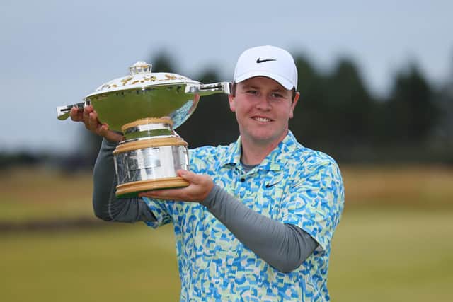 Bob MacIntyre shows off the trophy after winning the Genesis Scottish Open at The Renaissance Club in July. Picture: Andrew Redington/Getty Images.