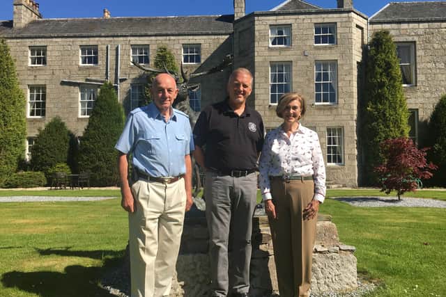 From left: Andrew Meiklejohn, Euan Shand and Linda Meiklejohn pictured outside The Castle Hotel. Picture: contributed.
