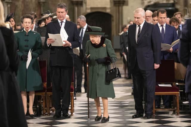 The Queen and the disgraced Duke of York arrive at a Service of Thanksgiving for the life of the Duke of Edinburgh, at Westminster Abbey in London on Tuesday.