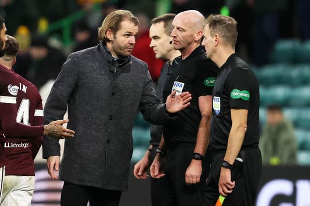 Hearts manager Robbie Neilson protests with linesman Alan Mulvanny at full time. (Photo by Alan Harvey / SNS Group)
