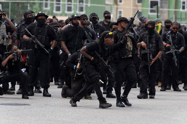 Many members of the NFAC, or "Not F***ing Around Coalition", militia were heavily armed (Picture: Jeff Dean/AFP via Getty Images)