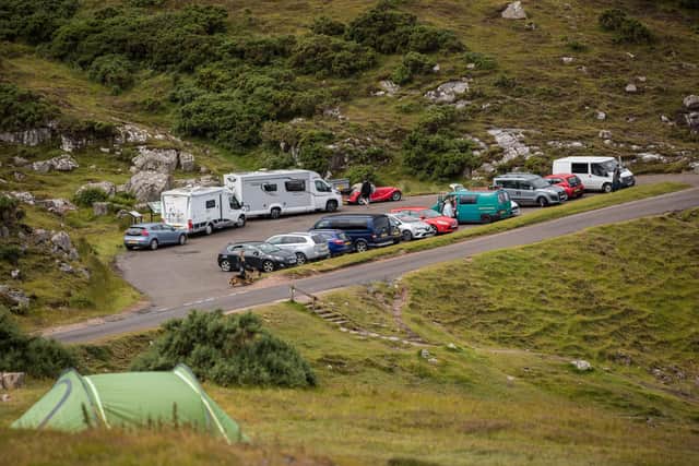 Car parks and beauty spots along the A838 are busy as tourists take to the North Coast 500 route in July last year (Photo by Paul Campbell/Getty Images)