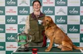 Labrador retriever Tweed and his owner Emma Bamford, from Inverness, collect the trophy for top dog in the gamekeeping classes at Crufts. Picture: Nigel Kirby
