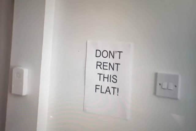 Signs were posted around the flat, warning prospective renters of its faults.