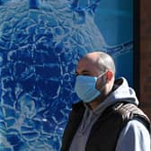 Wearing a Covid face mask in public places is once again a good idea (Picture: Oli Scarff/AFP via Getty Images)