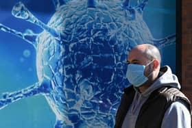 Wearing a Covid face mask in public places is once again a good idea (Picture: Oli Scarff/AFP via Getty Images)