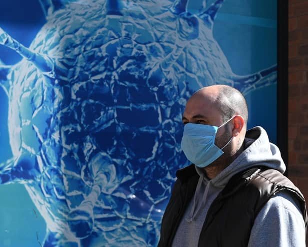 Wearing a Covid face mask in public places is once again a good idea (Picture: Oli Scarff/AFP via Getty Images)