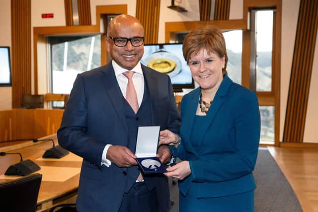 International metals and industrials entrepreneur Sanjeev Gupta today presented First Minister, Nicola Sturgeon, with a special commemorative medal cast from Lochaber aluminium to mark two years since his group the GFG Alliance began investing in Scottish industry. 

Picture Robert Perry i-Images 13th March 2018