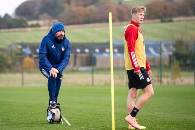 Aberdeen manager Derek McInnes (L) and Ross McCrorie during a training session at Cormack Park (Photo by Ross MacDonald / SNS Group)