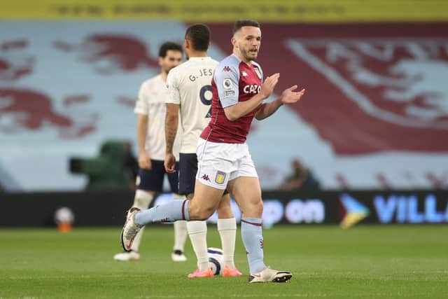 John McGinn of Aston Villa celebrates after scoring their side's first goal during the Premier League match between Aston Villa and Manchester City at Villa Park on April 21, 2021 (Photo by Carl Recine - Pool/Getty Images)