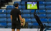 Referee reviews the VAR monitor for a potential penalty during Rangers and Red Star Belgrade. (Photo by Craig Foy / SNS Group)
