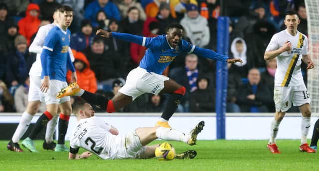 Rangers' Fashion Sakala is tackled by Livingston's Nicky Devlin during the match at Ibrox on Wednesday. (Photo by Alan Harvey / SNS Group)