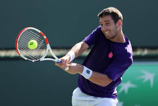 Cameron Norrie plays a backhand during his win over Tennys Sandgren at Indian Wells (Photo by Clive Brunskill/Getty Images)